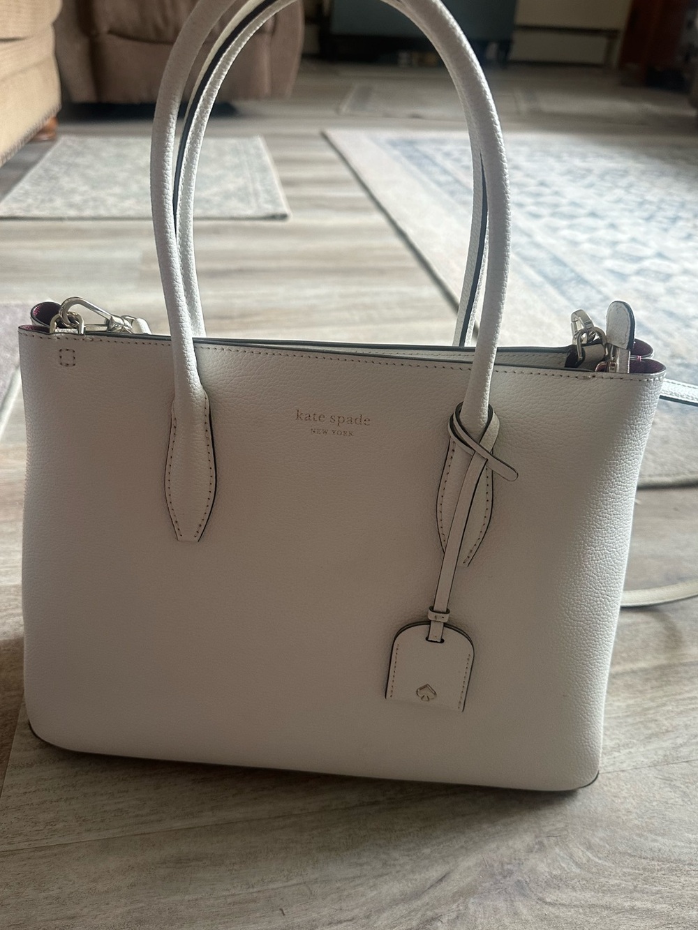 kate spade cream pebbled leather satchel with luggage tag